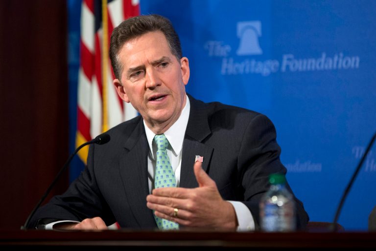 Jim DeMint, president of the Heritage Foundation, gestures during a news conference on immigration reform Monday, May 6, 2013, in Washington. The Heritage Foundation presented a study that immigration legislation would cost taxpayers $6.3 trillion to provide government benefits for millions of people now living in the U.S. illegally. (AP Photo/Evan Vucci)