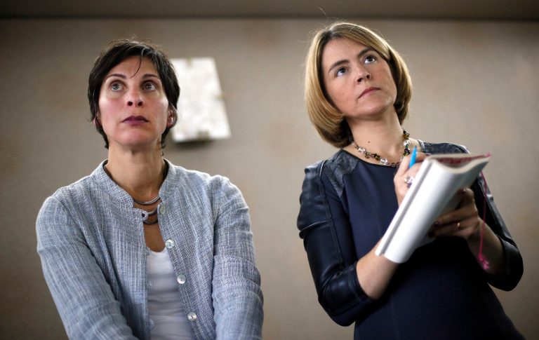 United Nations human rights experts Leilani Farha and Catarina de Albuquerque listen to questions during a news conference in Detroit, Monday, Oct. 20, 2014. United Nations human rights experts have called on Detroit officials to restore water to those unable to pay, including those with disabilities or chronic illnesses. (AP Photo/Paul Sancya)