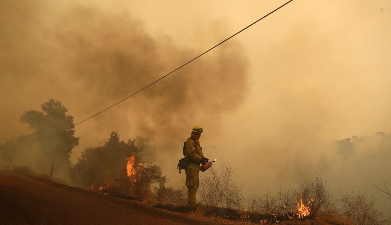 The California fires have released more than 10,000 tons of PM 2.5, particles that are a couple micrometers in diameter and regulated by the EPA due to concerns about their impact on human health. (AP Photo/Marcio Jose Sanchez)