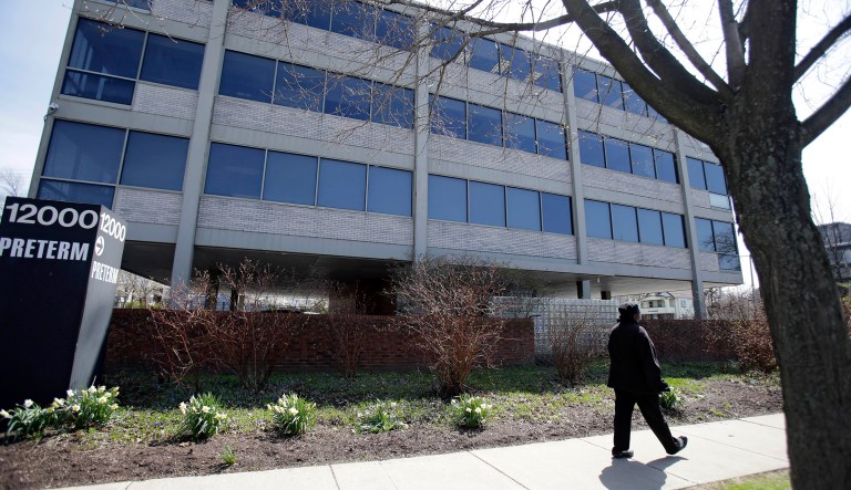 In this 2015 photo, a woman walks past Preterm, an abortion clinic, in Cleveland. This week, the Ohio Supreme Court ruled that Preterm of Cleveland can't sue over abortion-related restrictions which were in the state's budget bill back in 2013. (AP Photo/Tony Dejak)