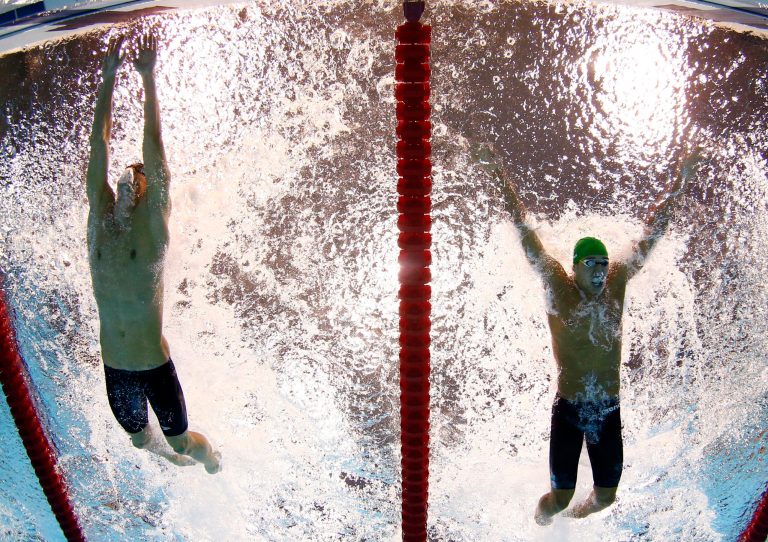   FILE - In this Aug. 3, 2012, file photo, Michael Phelps, of the United States, touches the wall ahead of Chad le Clos, of South Africa, for the win in the men's 100-meter butterfly final at the Aquatics Centre in the Olympic Park during the 2012 Summer Olympics in London. Phelps has added another triumph to his list of accomplishments: The Associated Press male athlete of the year, Thursday, Dec. 20, 2012. (AP Photo/Mark J. Terrill, File)  