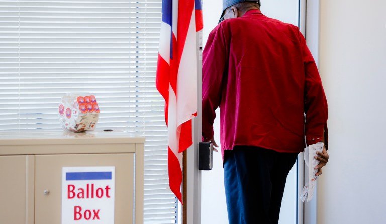 Both parties seem determined to turn off voters. (AP Photo/John Minchillo)