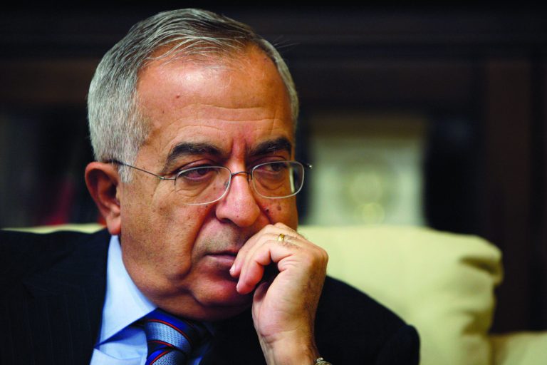 Palestinian Prime Minister Salam Fayyad pauses during an interview with the Associated Press in the West Bank city of Ramallah, Sunday, Jan. 6, 2013. Fayyad is blaming Arab countries that haven't delivered promised financial aid for an escalating financial crisis in the Palestinian territories. In an interview Sunday Fayyad said that the cash crunch is pushing an additional 25 percent of the Palestinian population, or 1 million people, into poverty.(AP Photo/Majdi Mohammed)