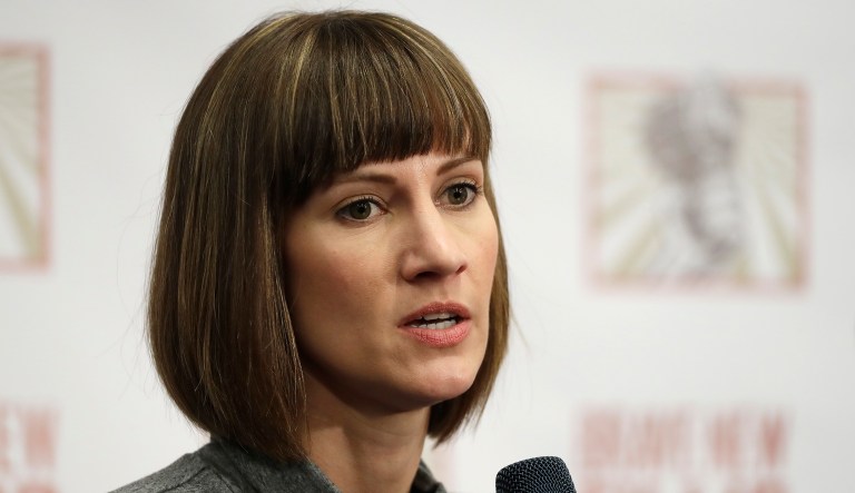 Rachel Crooks said while working at Trump Tower as a 22-year-old, Trump kissed her repeatedly against her will when she introduced herself to the businessman. (AP Photo/Mark Lennihan)