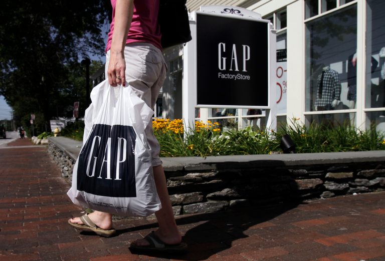 FILE - In this Wednesday, Aug. 17, 2011, file photo, a shopper leaves the Gap store in Freeport, Maine. Gap Inc. reports quarterly earnings on Thursday, May 22, 2014. (AP Photo/Pat Wellenbach, File)