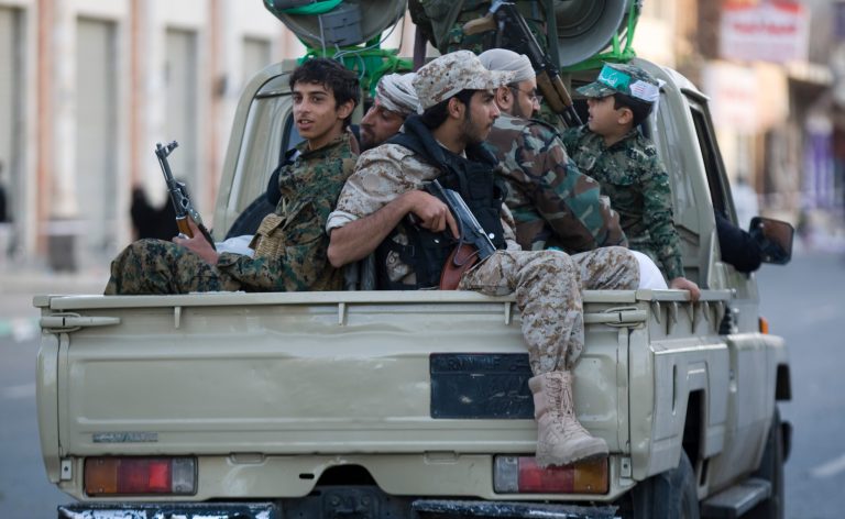 Houthi Shiite fighters wearing an army uniform ride on a pickup vehicle as they patrol a street during a demonstration to show support for their comrades in Sanaa, Yemen, Friday, Jan. 23, 2015. Thousands of protesters demonstrated Friday across Yemen, some supporting the Shiite rebels who seized the capital and others demanding the country's south secede after the nation's president and Cabinet resigned. (AP Photo/Hani Mohammed)