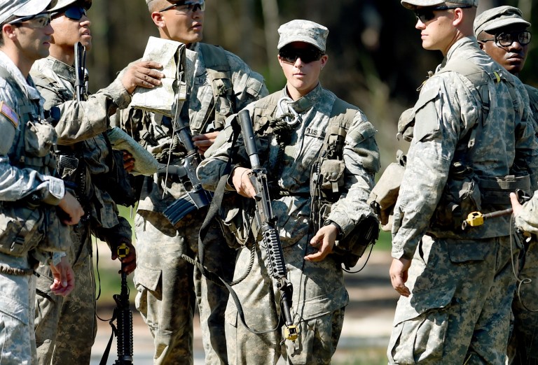 In this photo taken on Aug. 4, 2015, a female Army Ranger stands with her unit during Ranger School at Camp Rudder on Eglin Air Force Base, Fla. (Nick Tomecek/Northwest Florida Daily News via AP)