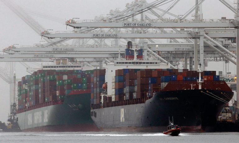 Container ships wait to be off-loaded in a thick fog at the Port of Oakland in Oakland, Calif. The Commerce Department releases fourth-quarter gross domestic product Friday. (AP/Ben Margot)