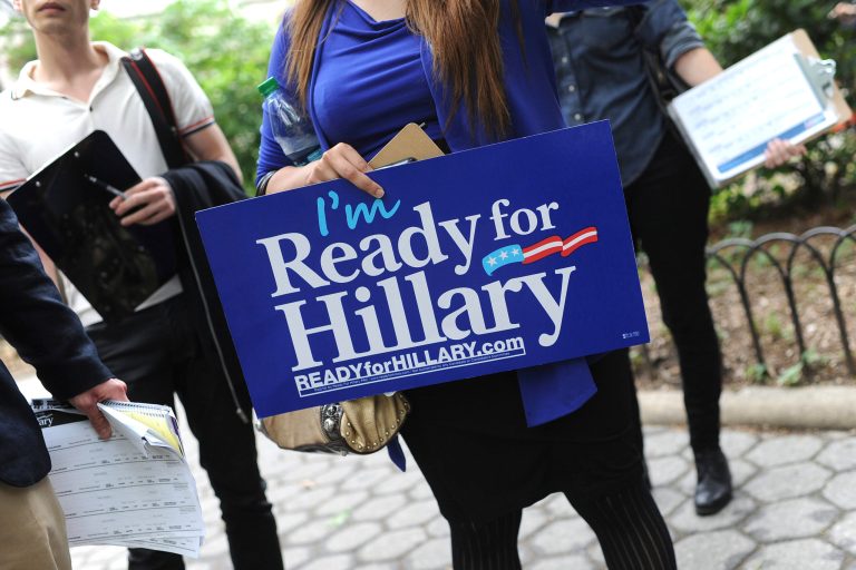 A woman holding a pro-Hillary Clinton sign. (Anthony Behar/Sipa USA)