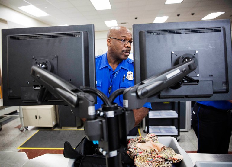Customs and Border Protection will require passengers to present their boarding passes while a digital photo is taken of them. (AP Photo/David Goldman)