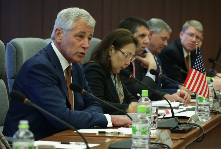 U.S. Secretary of Defense Chuck Hagel, left, speaks during a meeting with Japanese Defense Minister Itsunori Onodera at the Japanese Ministry of Defense headquarters April 6, 2014 in Tokyo, Japan. Secretary Hagel is visiting Japan, China and Mongolia, his fourth trip to Asian nations since taking office. (AP Photo/Alex Wong, POOL)