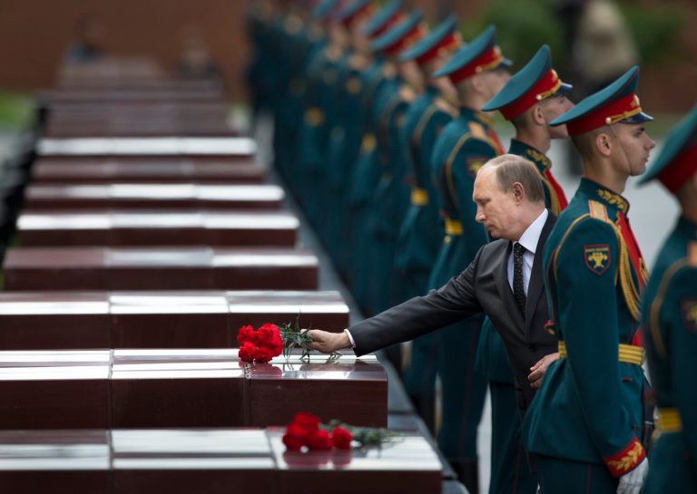 Russian Vladimir Putin, second right, takes part in a wreath laying ceremony at the Tomb of the Unknown Soldier outside Moscow's Kremlin Wall, in Moscow, Russia, Sunday, June 22, 2014,  to mark the 73rd anniversary of the Nazi invasion of the Soviet Union. (AP Photo/Alexander Zemlianichenko)