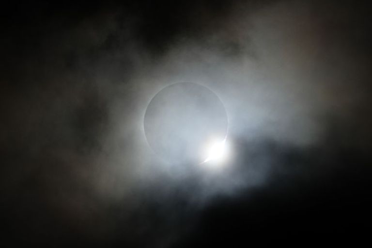 Prufrock: Mysterious Dark Matter, Bacteria Balloons and the Solar Eclipse, Glen Campbell and Charles Portis