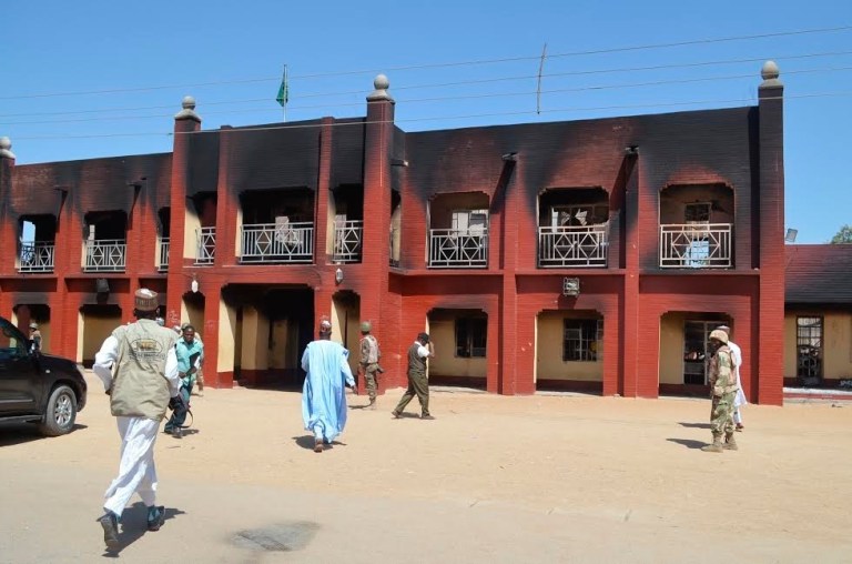 People inspect the burnt out palace following an attack by Boko Haram in Bama, Nigeria. (AP/Jossy Ola)