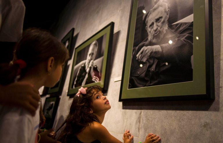 A girl attends an exhibition of photographs of Fidel Castro made ??by the photographer Roberto Chile at the Jose Marti Memorial in Havana, Cuba, Tuesday, Aug. 12, 2014.  Castro will celebrate his 88th birthday on Wednesday. (AP Photo / Ramon Espinosa)