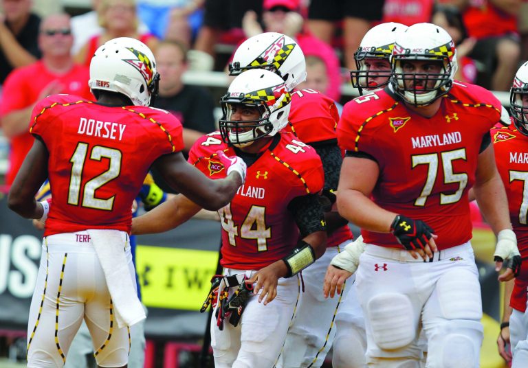 Luis M. Alvarez/AP
Maryland tackle Justin Gilbert, right, tore his ACL the last time the Terps were in Morgantown, W.Va.