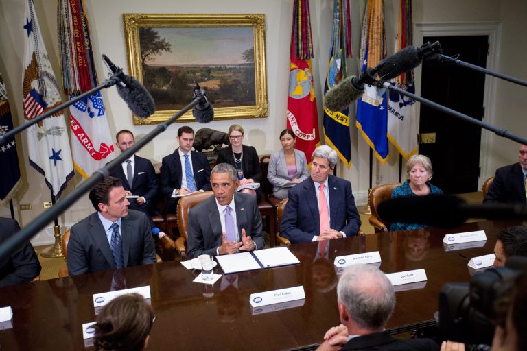 President Obama, accompanied by, from left, Nathan Fletcher, of the Truman National Security Project, Secretary of State John Kerry, and Gold Star Mother Michelle DeFord, meets with veterans and Gold Star Mothers to discuss the Iran nuclear deal, Thursday, Sept. 10, 2015, in the Roosevelt Room of the White House in Washington. (AP Photo/Andrew Harnik)
