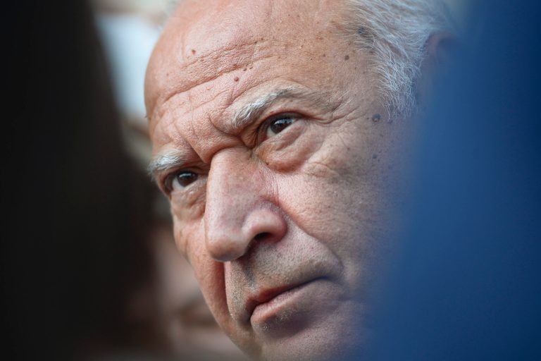 This photo taken Tuesday, Aug. 5, 2014, shows Dan Voiculescu, a Romanian media mogul, addressing the media, after exiting the Appeal Court's building in Bucharest, Romania.  The court sentenced Voiculescu, who resigned as a senator in 2013, on Friday, Aug. 8, 2014, to ten years in jail for money laundering and using his political influence to buy the Romanian Food Research Institute for 100,000 euros ($135,000) _ a fraction of its estimated value of 7.7 million euros ($10.3 million). (AP Photo/Octav Ganea, Mediafax) ROMANIA OUT