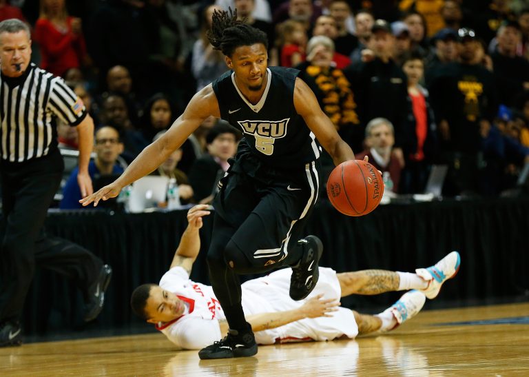 Doug Brooks #5 of the Virginia Commonwealth Rams and Kyle Davis #3 of the Dayton Flyers battle for the ball during the Atlantic 10 Basketball Tournament - Championship game at Barclays Center on March 15, 2015 in New York, New York. The Rams defeated the Flyers 71-65. (Photo by Mike Stobe/Getty Images)