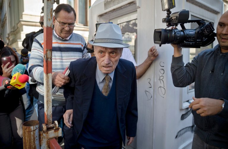 Romania puts ex-communist prison chief on trial