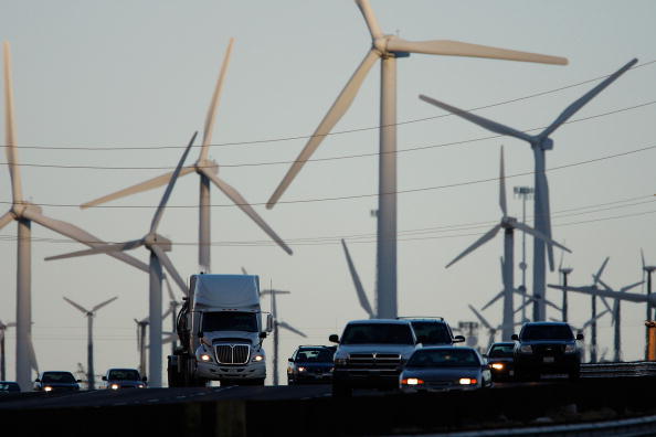 BANNING, CA - DECEMBER 8:  Emissions-producing diesel trucks and cars pass non-polluting windmills along the 10 freeway on December 8, 2009 near Banning, California. Sustained global warming shows no sign of letting up according to new analysis by the World Meteorological Organization made public at the climate talks in Copenhagen. Although global temperature fluctuates from year to year, overall the decade of the 2000s is likely the warmest decade in the past 150 years covered by the report. This decade is warmer than the 1990s which were warmer than the 1980s, and so on. The conclusion meshes with independent analysis by the National Climatic Data Center and NASA.  (Photo by David McNew/Getty Images)