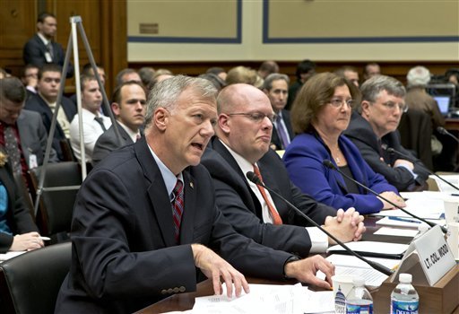 Lt. Col. Andrew Wood, left, a Utah National Guard Army Green Beret who was the top security official at the United States consulate in Libya, answers questions from the House Oversight and Government Reform Committee. (AP photo)