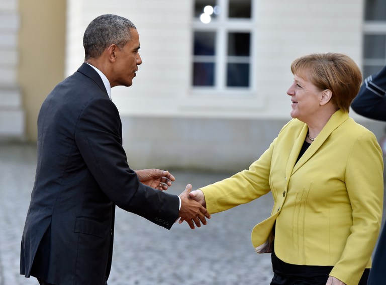 Obama was greeted by Merkel in Hannover at the Schloss Herrenhausen, an historic palace. (AP Photo/Martin Meissner)