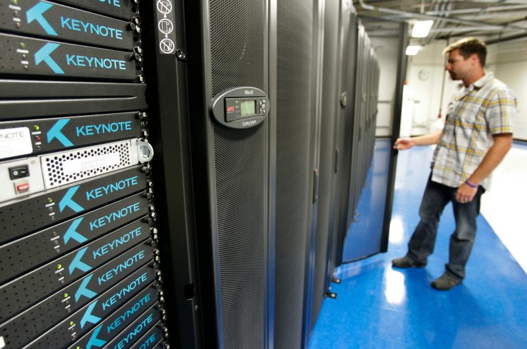 Shawn White, director of external operations for Keynote Systems, is shown in the data storage room at Keynote headquarters in San Mateo, Calif., in July 2009. (AP Photo/Paul Sakuma)