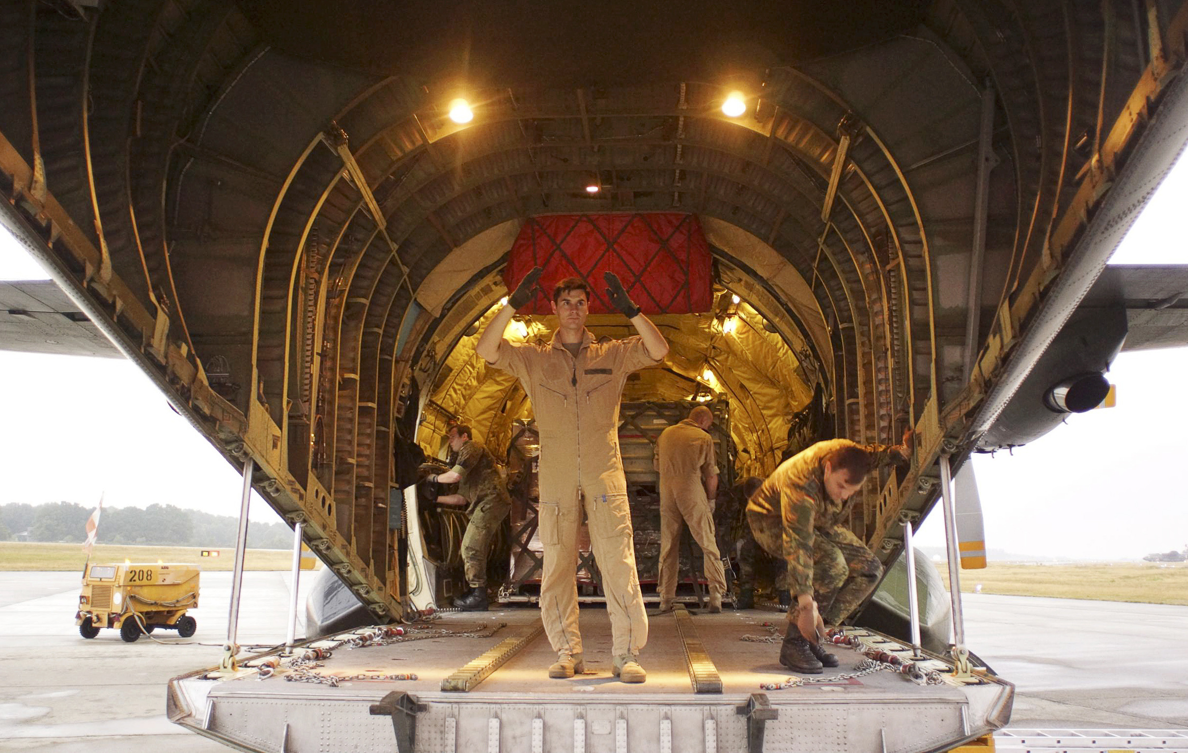Seeing Iraq horror, Europe pledges aid and arms