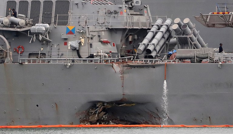 The separate collisions left seven Fitzgerald sailors dead and as many as 10 dead from the McCain. (AP Photo/Wong Maye-E)