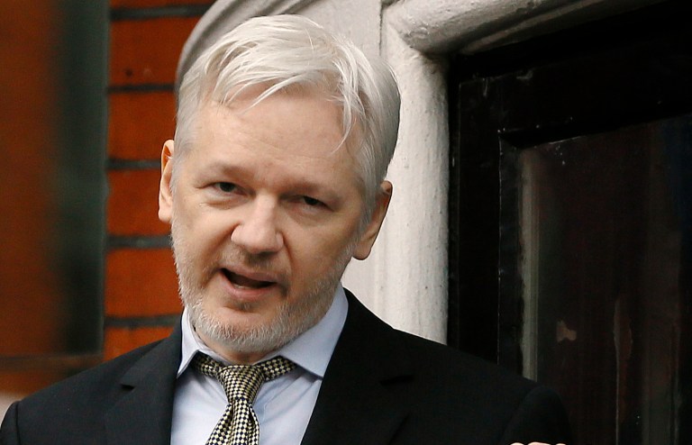 WikiLeaks founder Julian Assange is going to release his personal medical records in an effort to encourage presidential contenders Donald Trump and Hillary Clinton to follow suit. (AP Photo/Kirsty Wigglesworth)