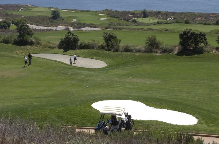 Environmentalists vandalized one of President Trump's golf courses over the weekend by carving a giant message into one of the greens. (AP Photo/Reed Saxon)