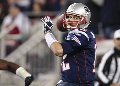 Elise Amendola/AP
Tom Brady and the New England Patriots are 7-3 and atop the AFC after Monday night's win.