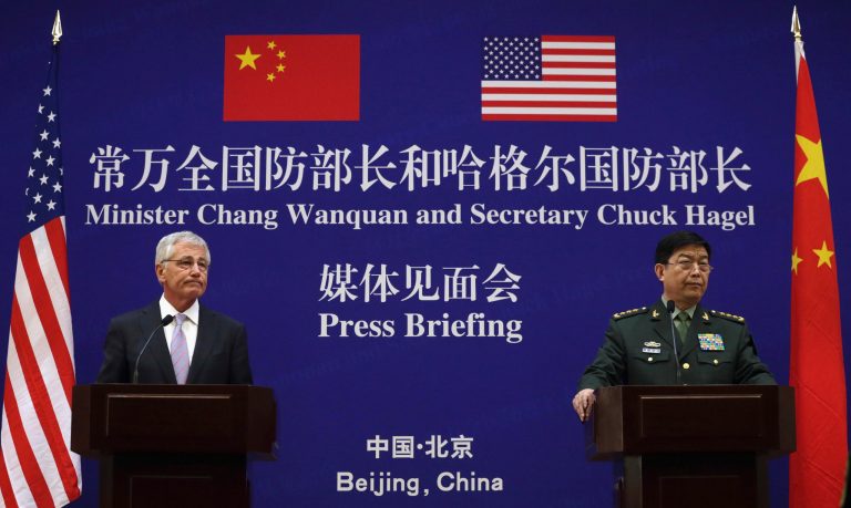 U.S. Defense Secretary Chuck Hagel, left, and Chinese Defense Minister Chang Wanquan participate in a joint news conference at the Chinese Defense Ministry headquarters in Beijing, China Tuesday, April 8, 2014. The defense chiefs of China and the U.S. faced off Tuesday over Beijing's escalating territorial disputes in the region, as Hagel, wagging his finger, said China doesn't have the right to unilaterally establish an air defense zone over disputed islands with no consultation. (AP Photo/Alex Wong, Pool)