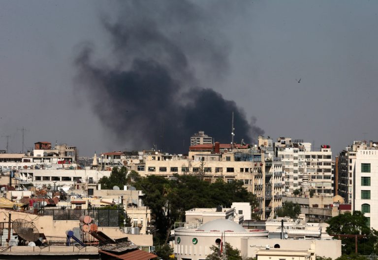 Black columns of smoke rise from heavy shelling in the Jobar neighborhood, east of Damascus, Syria, on Sunday. (AP Photo/Hassan Ammar)