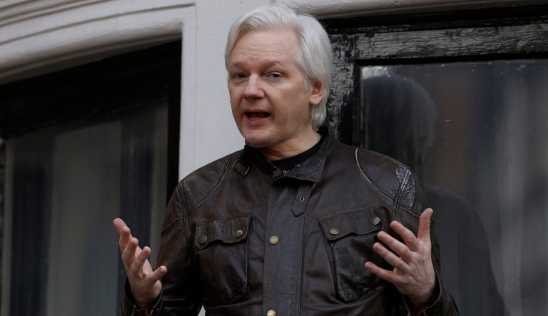Julian Assange, founder of WikiLeaks, speaks to media and supporters from a balcony at the Ecuadorian embassy in London, U.K., on on Friday, May 19, 2017. 
