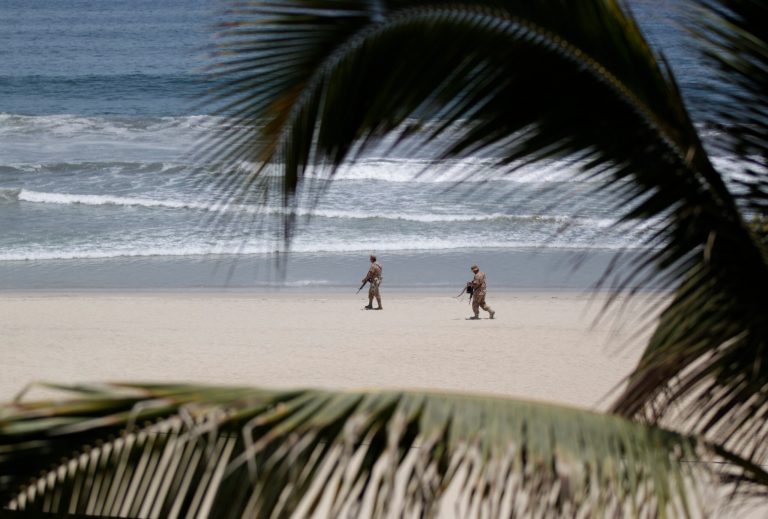   Mexican soldiers patrol the beach of San Jose del Cabo in Mexico's Baja Peninsula, Sunday, June 17, 2012. The G-20 summit starts in Los Cabos on Monday. (AP Photo/Eduardo Verdugo)  