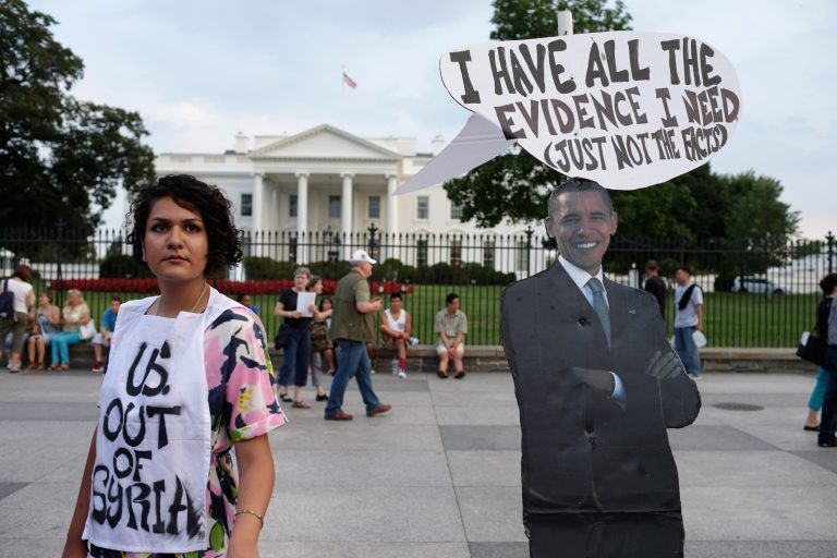 A lifesize cardboard cutout photograph of President Obama is used as an anti-war sign on the north side of the White House to protest any U.S. military action against Syria.  (Chip Somodevilla/Getty Images)