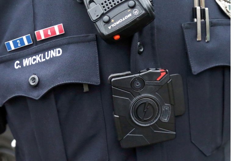 Body cameras are being added to police uniforms as part of President Obama's 21st Century Policing initiative, while bystanders frequently are capturing video of police interactions on their smartphones. (AP Photo)Â 