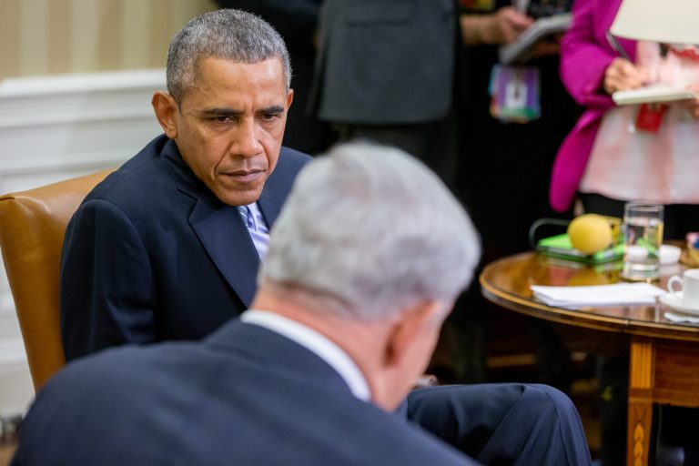 President Barack Obama listens to Israeli Prime Minister Benjamin Netanyahu, foreground, as he speaks while meeting in the Oval Office of the White House in Washington, Monday, Nov. 9, 2015. The president and prime minister sought to mend their fractured relationship during their meeting, the first time they have talked face to face in more than a year. (AP Photo/Andrew Harnik)