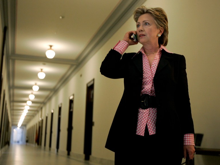 Then-U.S. Sen. Hillary Rodham Clinton, D-N.Y., talks on a cell phone in the hallway of the Russell Senate office building in 2007. (AP Photo/Susan Walsh)