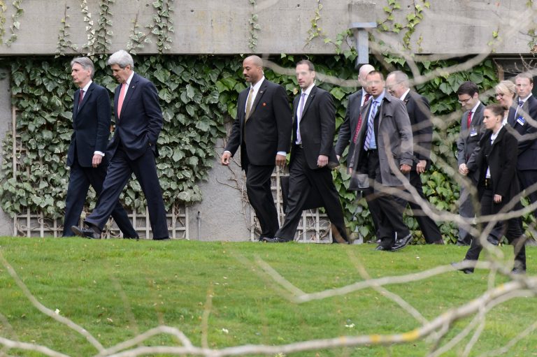 U.S. Secretary of State John Kerry, second left, and British Foreign Secretary Philip Hammond, left, walk together outside the hotel during a break of the new round of talks on Iran's nuclear program, in Lausanne, Switzerland, Monday, March 30, 2015. (AP Photo/Keystone, Jean-Christophe Bott)