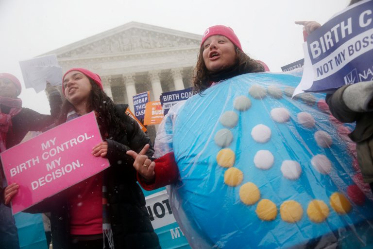 Margot Riphagen of New Orleans, La., wears a birth control pills costume as she protests in front of the Supreme Court in Washington, Tuesday, March 25, 2014, as the court heard oral arguments in the challenges of President Barack Obama's health care law requirement that businesses provide their female employees with health insurance that includes access to contraceptives. Supreme Court justices are weighing whether corporations have religious rights that exempt them from part of the new health care law that requires coverage of birth control for employees at no extra charge.