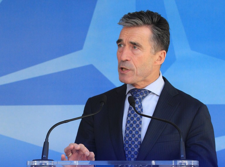 NATO Secretary General Anders Fogh Rasmussen addresses the media after an NATO Ambassadors Council at NATO headquarters in Brussels, Wednesday, April 16, 2014. NATO says it's reinforcing its military presence on eastern border on sea, land and in the air. (AP Photo/Yves Logghe)