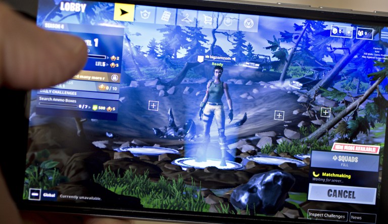 The Epic Games Inc. Fortnite: Battle Royale video game is displayed for a photograph on an Apple Inc. iPhone in Washington, D.C., U.S., on Thursday, May 10, 2018. Fortnite, the hitÂ gameÂ that's denting the stock prices of video-gameÂ makers after signing up 45 million players, didn't really take off until it became free and a free-for-all.