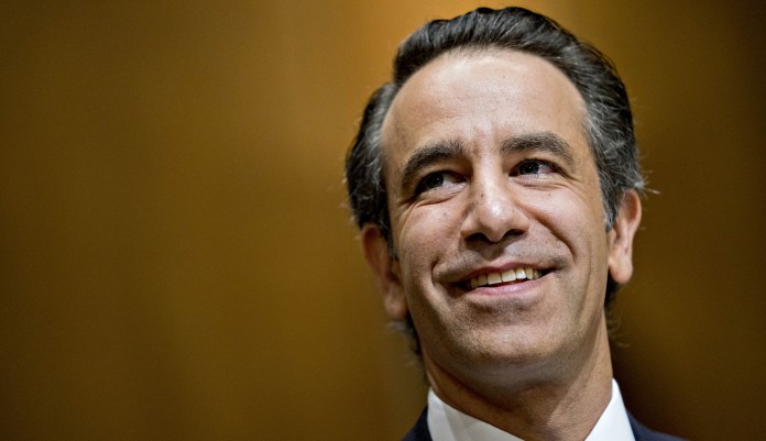 Justin Muzinich, U.S. deputy Treasury secretary nominee for President Trump, smiles during a Senate Finance Committee confirmation hearing in Washington, D.C., U.S., on Thursday, July 26, 2018.