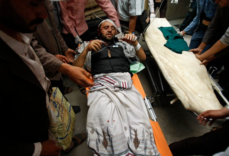 Hawthi protesters bring a fellow protester, who was injured in clashes with Yemeni police, to a hospital, in Sanaa, Yemen, Tuesday, Sept. 9, 2014. Yemeni police opened fire on Shiite Hawthi protesters marching toward the prime minister's office in the capital, Sanaa, killing several people and wounding many, officials said. The Hawthi protest threatens to further destabilize volatile Yemen, the Arab world's most impoverished country where authorities continue to battle militants led by the country's al-Qaida branch, considered by the U.S. to be the world's most dangerous offshoot of the terror group. (AP Photo/Hani Mohammed)