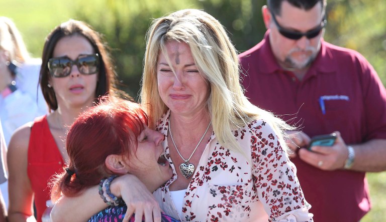 The shooter fired shots both outside and inside of the school at varying times according to police. (AP Photo/Joel Auerbach)