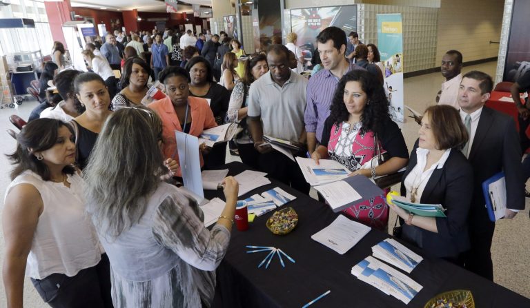 Job seekers get information at a job fair in Sunrise, Fla. The Labor Department releases weekly jobless claims on Thursday. (AP Photo/Alan Diaz)