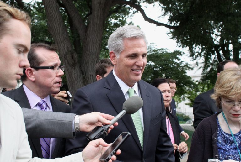 House Majority Whip Kevin McCarthy of Calif is pursued by reporters on Capitol Hill in Washington, Thursday, June 19, 2014, after being elected the new House majority leader by the Republican Conference, replacing Rep. Eric Cantor, R-Va., who was defeated in his primary earlier this month.  Rep. Steve Scalise, R-La., is taking McCarthy's place as GOP whip. (AP Photo/Lauren Victoria Burke)